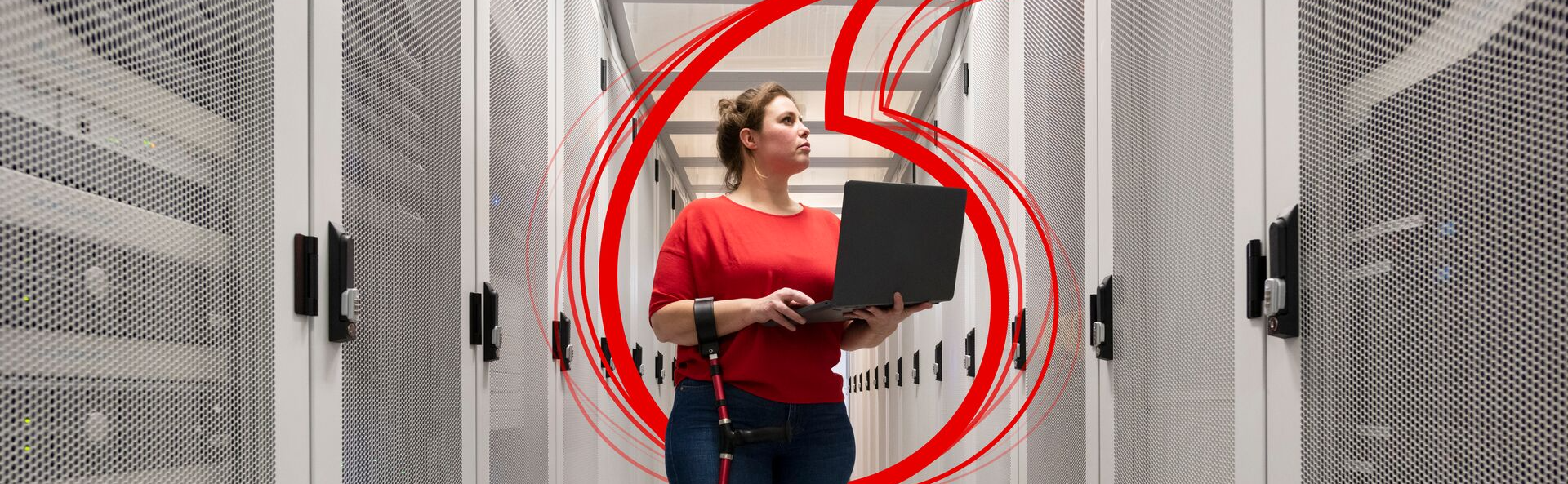 women with a laptop inside a data center