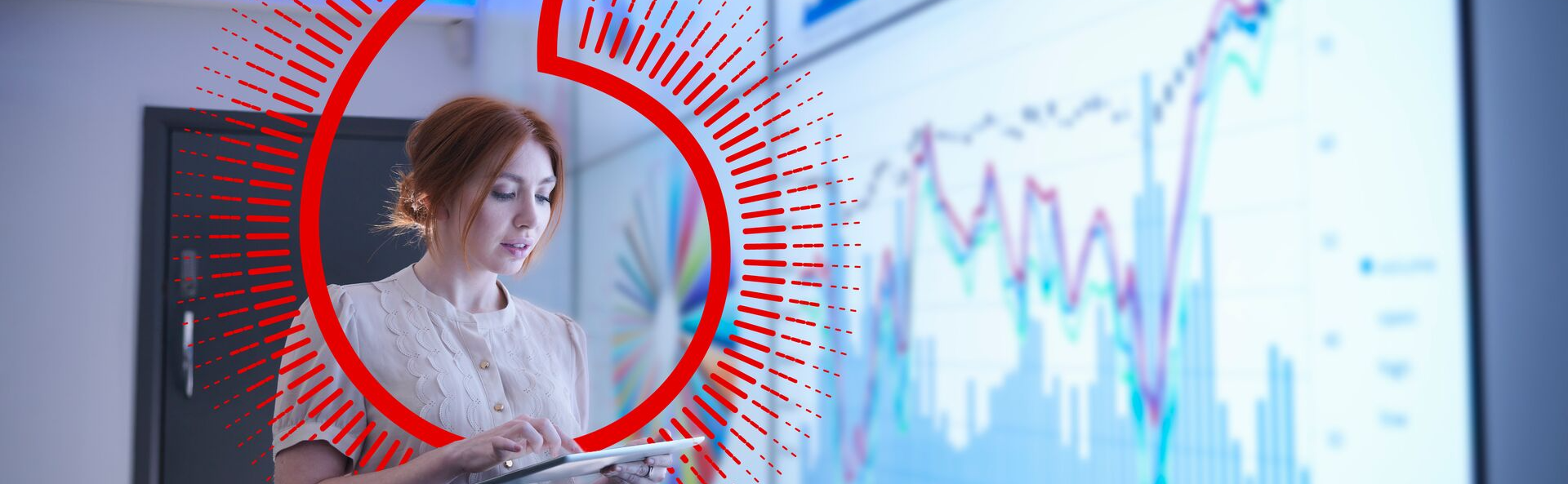 women taking notes in front of monitors